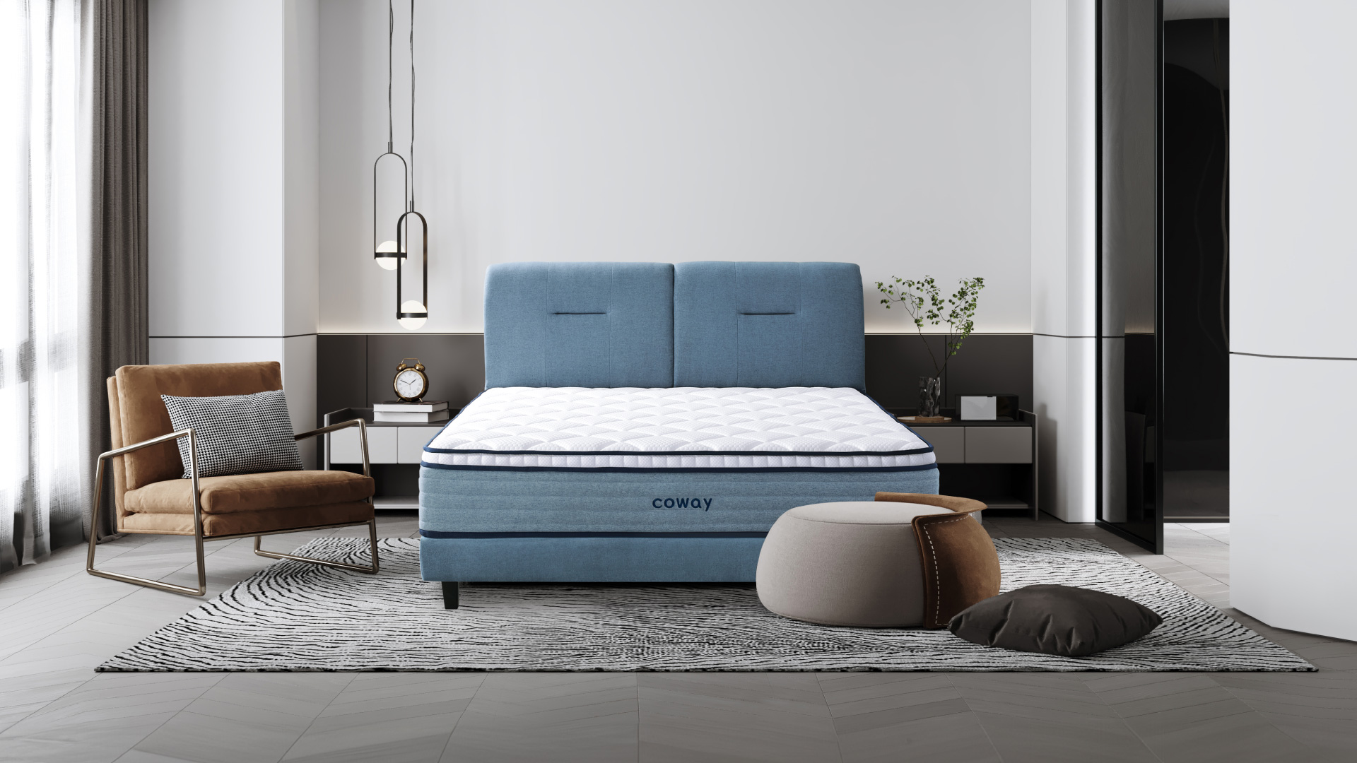 Coway Prime Lite Series Mattress At The Center Of The Room With An Armchair And A Footrest With A Pillow On The Floor - Coway Prime Lite Series